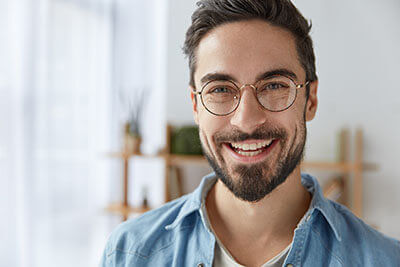 Man Smiling With Glasses